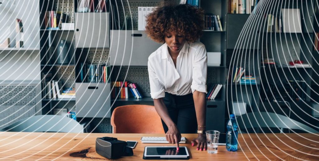 Woman using ipad on desk