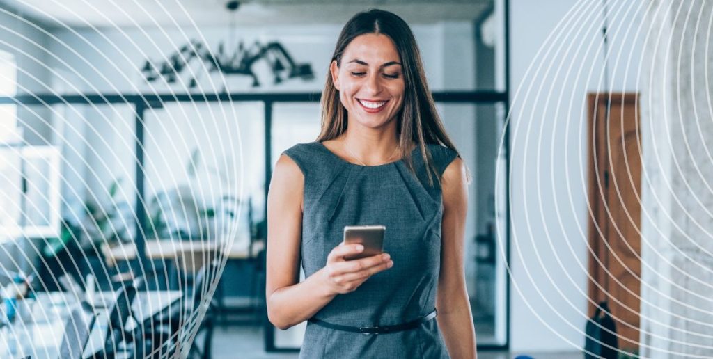 Lady smiling at her phone