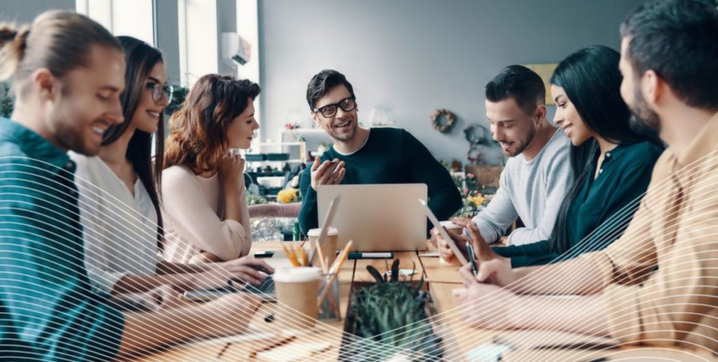 Group in a meeting with laptops